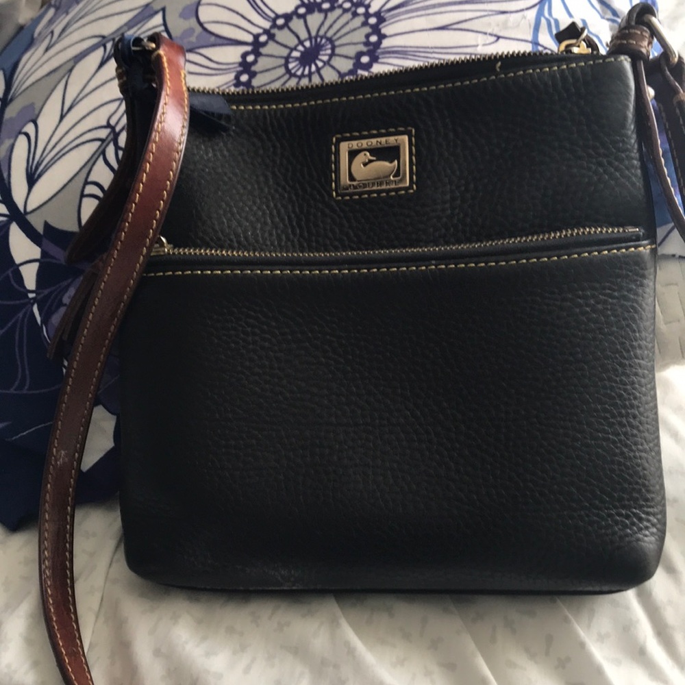 Authentic Dooney & Bourke.  Torn lining. Some spot